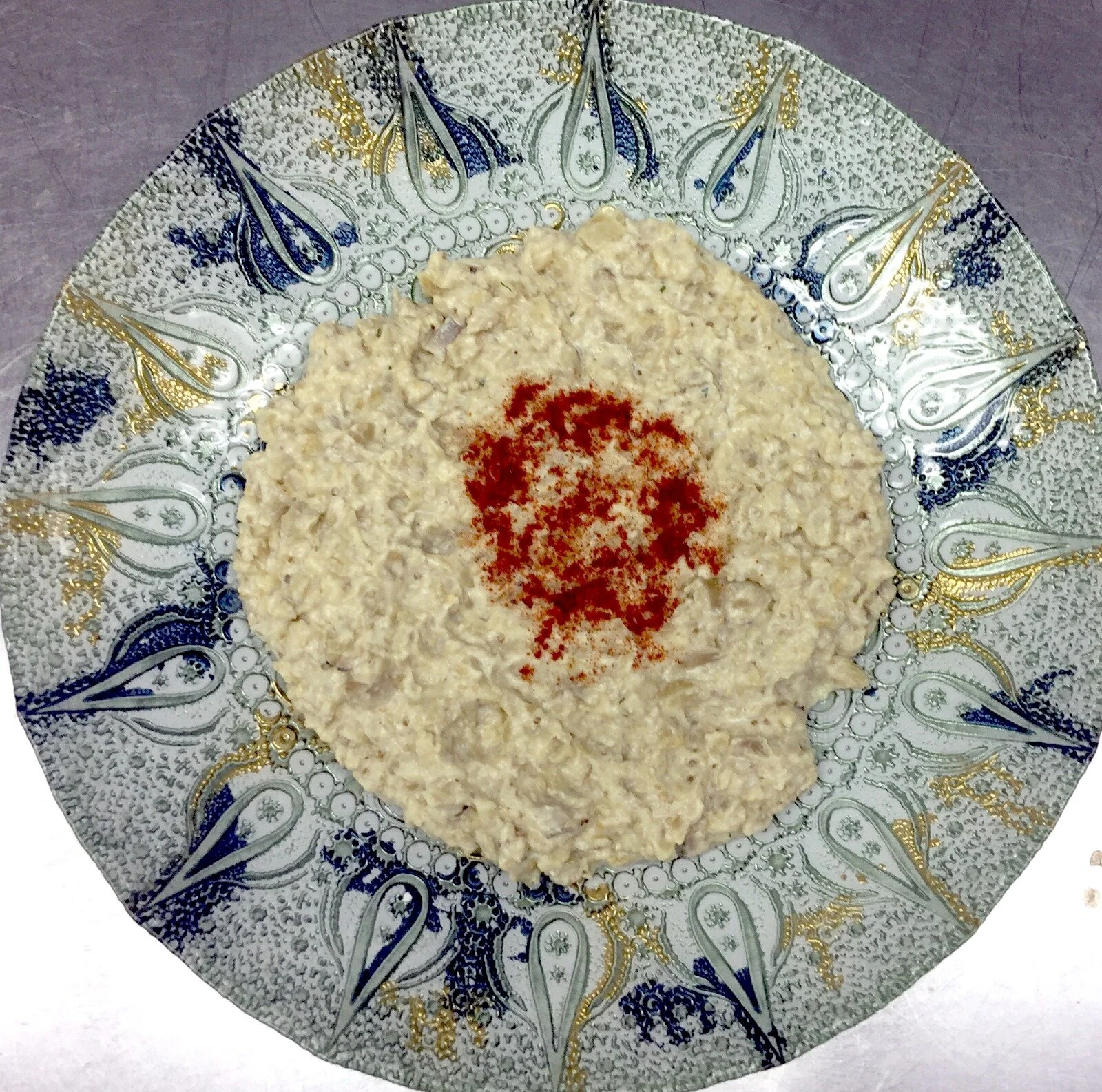 Hummus on a hand-painted Turkish ceramic plate