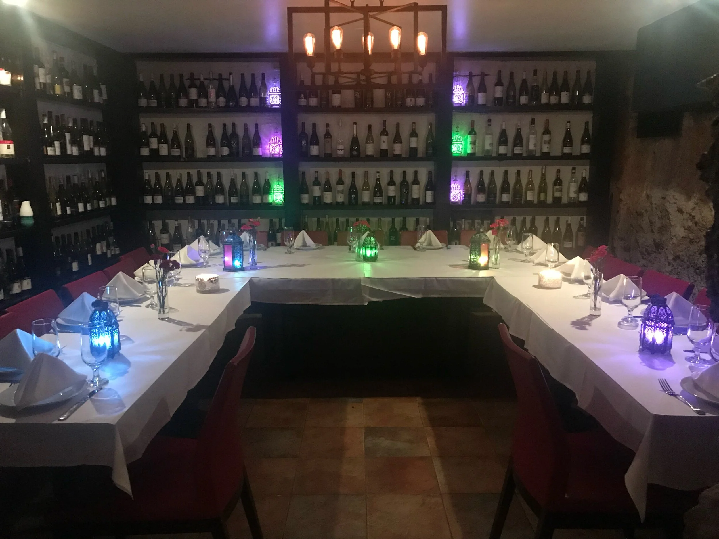 Wine cellar — private dinner setup with lanterns